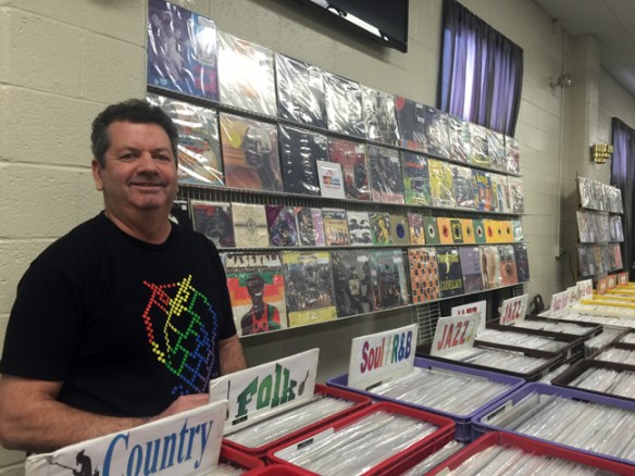 Tom Konopka from Rochester, NY shows off his booth of extensive music offerings.