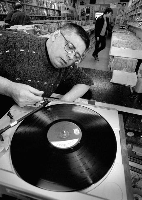 Mr. Groff in 1997, cuing up a record at his store in Rockville. (Robert A. Reeder:The Washington Post).jpg